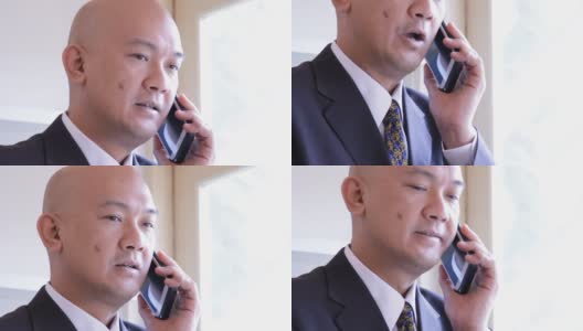 一位亚洲企业高管在用手机聊天高清在线视频素材下载