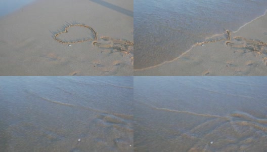 心的形状在沙子被海浪冲走高清在线视频素材下载
