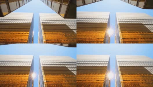 在蓝天的映衬下，商业区的现代摩天大楼高清在线视频素材下载