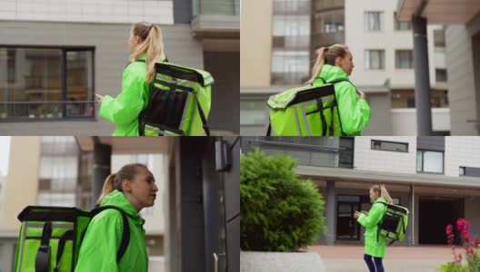 追踪慢动作拍摄的十几岁女食品快递员穿着绿色制服，带着保暖袋走在街上用智能手机上的导航应用程序，按门铃进入大楼高清在线视频素材下载