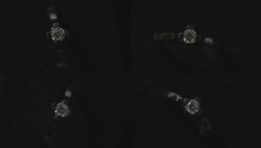 微距拍摄的婚礼戒指在黑暗中高清在线视频素材下载