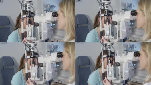 一位年轻女子正在让眼科医生检查她的眼睛高清在线视频素材下载