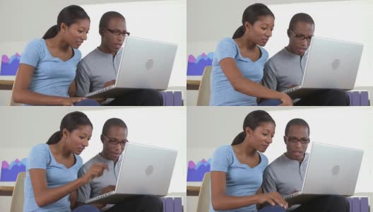 两个黑人商业伙伴在用笔记本电脑高清在线视频素材下载