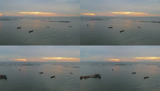 鸟瞰图捕鱼吹嘘在日落在昂西拉海滩泰国高清在线视频素材下载