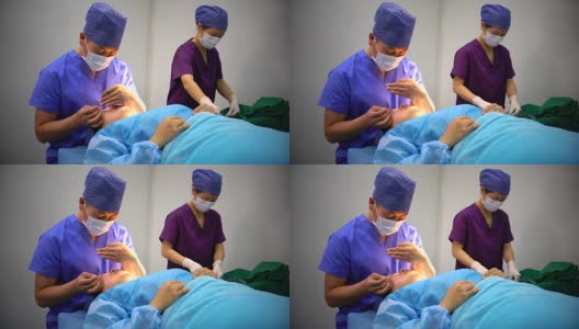 4K:医生在现代手术室为病人准备手术的肖像。高清在线视频素材下载