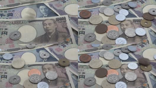 近距离观察日本硬币日元的下落，纸币上有1000和10000日元的背景声高清在线视频素材下载