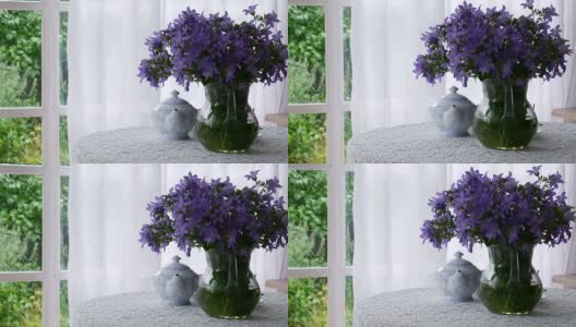 一壶茶和一束蓝色的花。高清在线视频素材下载