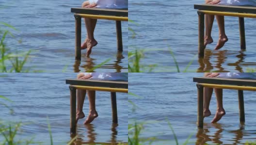 那个女孩坐在河边的一个木码头边上休息。高清在线视频素材下载