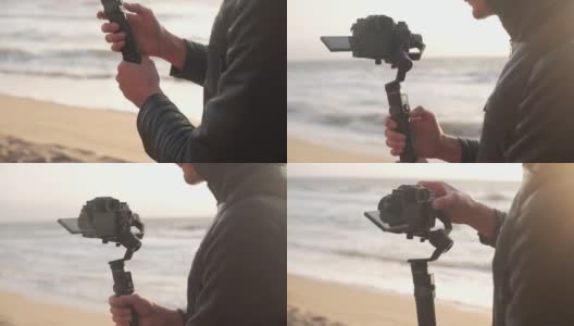 电影制作人在日出时用电子稳定器在海滩上用相机拍摄视频高清在线视频素材下载