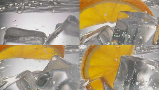 橙子片掉进水里，里面还有冰块高清在线视频素材下载