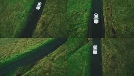 鸟瞰图电动汽车行驶在乡村道路上高清在线视频素材下载
