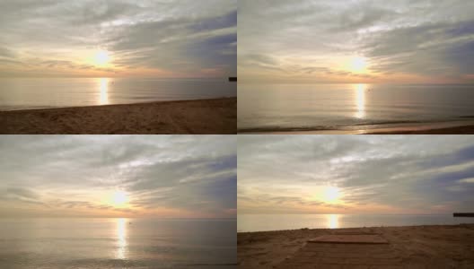 日落海滩。波夫在海滩上散步。波夫拍摄的海边日落在沙滩上高清在线视频素材下载