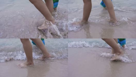 慢镜头:妈妈和她的小女儿在海边跑步高清在线视频素材下载