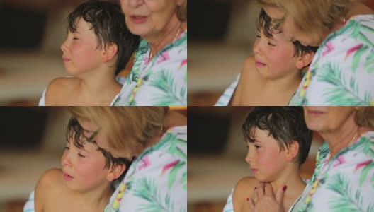 祖母安慰哭泣的孩子。哭泣的小男孩哭了。真实的慢镜头120帧每秒的剪辑高清在线视频素材下载