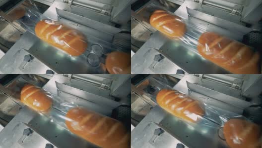 上面的白面包面包覆盖着透明的薄膜移动。高清在线视频素材下载