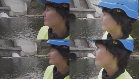 一个严肃的女工程师的肖像戴着一个工人的头盔高清在线视频素材下载