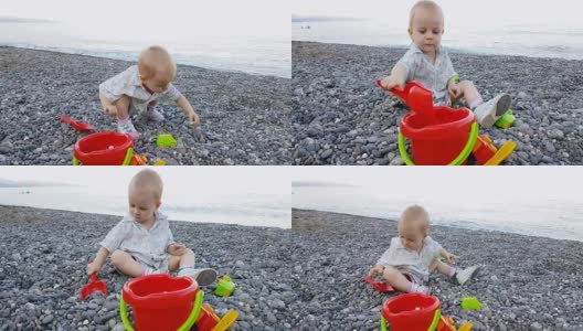 小男孩暑假在海滩上玩鹅卵石高清在线视频素材下载