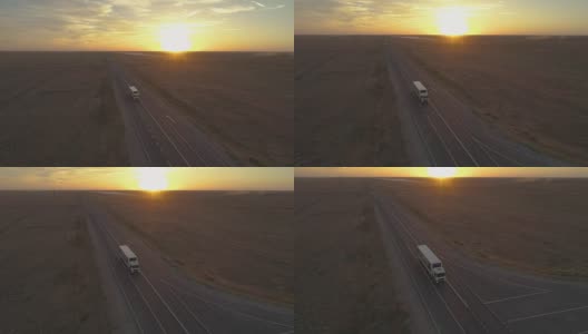 卡车在阳光明媚的傍晚行驶在公路上。鸟瞰图。相机向下倾斜。高清在线视频素材下载