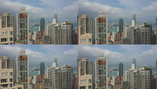 阳光明媚的一天香港市景市中心公寓大楼航拍全景4k高清在线视频素材下载