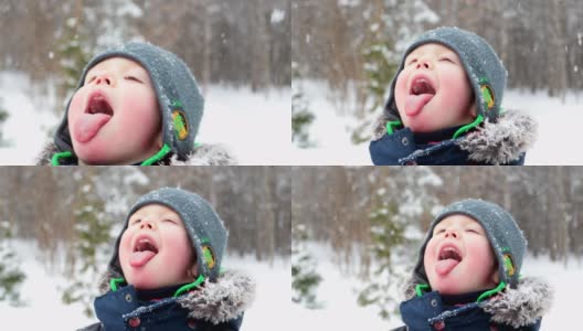 用舌头接雪花的小男孩高清在线视频素材下载