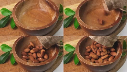 Almond Nuts to pour In Wooden Bowl. Healthy Food Concept.高清在线视频素材下载