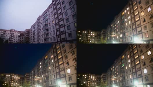 夜间窗户照明变化的多层建筑高清在线视频素材下载
