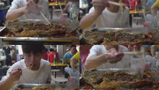 在新加坡街头吃小吃的年轻人高清在线视频素材下载