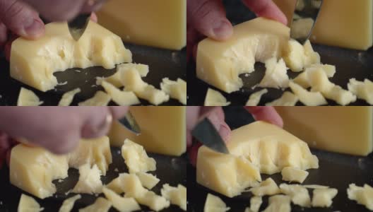 男性用刀切帕尔玛干酪片。高清在线视频素材下载