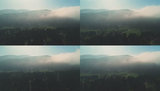 日出在雾蒙蒙的森林和山区景观，4k航拍视频高清在线视频素材下载