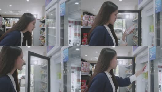 一名亚洲女商人身穿蓝色休闲装，正在一家杂货店购买商品和服务，然后在当地的一家泰国商店回家。高清在线视频素材下载