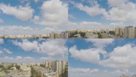 延时相机从白云中向下移动到一个简单的城市社区高清在线视频素材下载