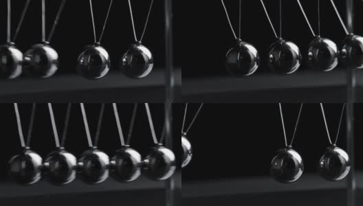 悬挂的钢铁牛顿球在黑色背景下运动的镜头高清在线视频素材下载