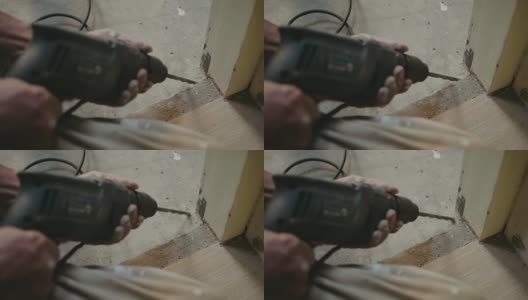 一个老人在家里用电钻做DIY。高清在线视频素材下载