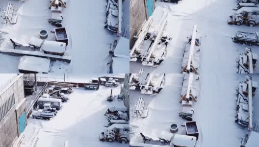 在大雪纷飞的冬天，一队建筑设备。高清在线视频素材下载