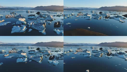 4K空中电影飞越冰川碎片泻湖，冰岛Jokulsarlon高清在线视频素材下载