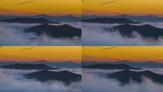 快速移动的云雾在金色日出的蓝岭山脉高清在线视频素材下载