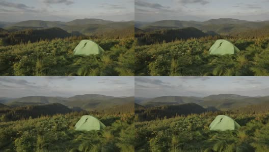 山中旅游帐篷上的夕阳，风吹动了小草高清在线视频素材下载