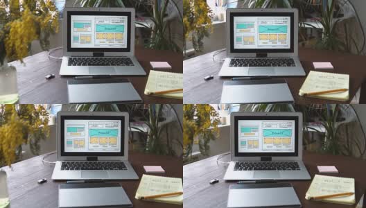 Web开发人员坐在桌子前绘制未来网站的草图。在家办公远程办公高清在线视频素材下载