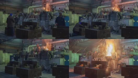 在铸造车间辛勤工作，工人在熔炉中控制铁的冶炼，工作环境太热、冒烟。金属铸造视频全高清视频延时高清在线视频素材下载