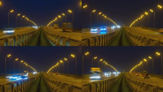 公路交通车辆在夜间时间流逝。汽车行驶在道路上的桥晚上延时。4 k UHD高清在线视频素材下载