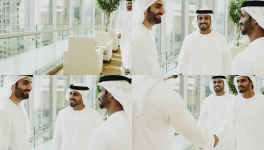 迪拜商业区的男同事们握手问候高清在线视频素材下载