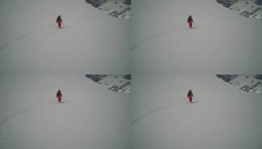 乡间滑雪者下山，积着厚厚的粉雪高清在线视频素材下载