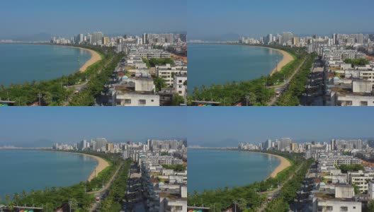 阳光明媚的一天飞行在三亚著名的岛屿城市海滩湾航空全景4k中国海南高清在线视频素材下载