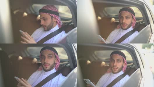 阿拉伯中东男子在车里使用智能手机的肖像高清在线视频素材下载