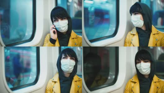 一位戴着医用口罩的女志愿者正在地铁里打电话。高清在线视频素材下载