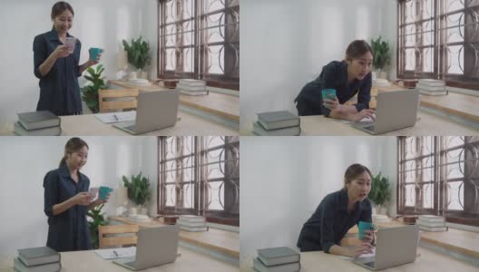 微笑的女商人使用笔记本电脑在公寓工作期间愉快的电话信息高清在线视频素材下载