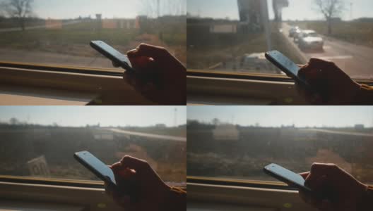 用手机靠近火车窗口，手指用手按屏幕购买电子车票高清在线视频素材下载