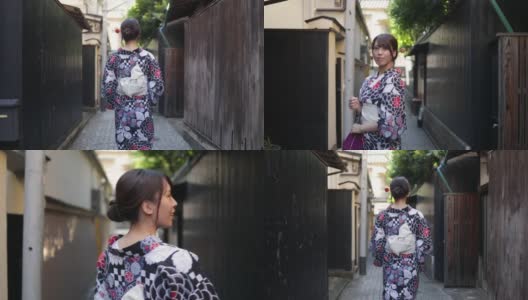 日本妇女在汤田走在狭窄的小路上-后视镜和向后看高清在线视频素材下载