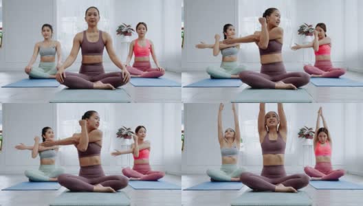 亚洲女瑜伽老师在课堂上教授学生基本练习、运动理念和健康高清在线视频素材下载