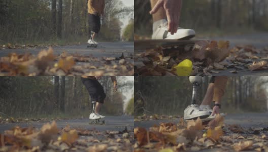 一个戴着金属仿生假肢的年轻人正在秋天的森林里玩滑板。一个假肢在滑板上推着沥青高清在线视频素材下载